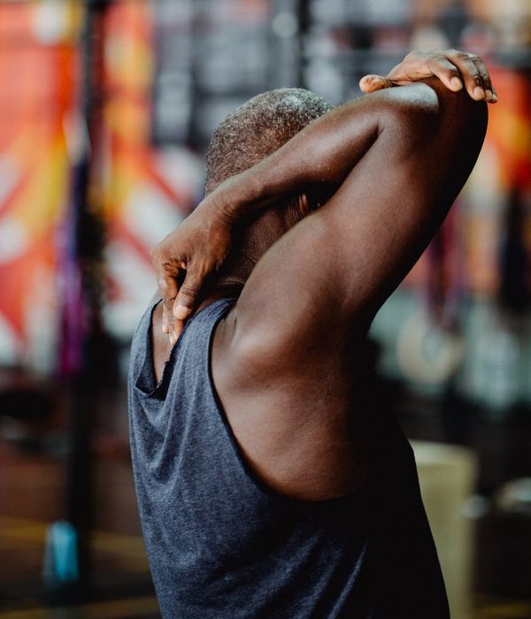 Athletic man in a dynamic pose, symbolizing strength and focus.